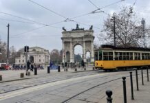 Milan Public Transport Strike on Friday, 9 October 2026: How to Plan Your Day Classic yellow ATM tram passing in front of the Arco della Pace in Milan